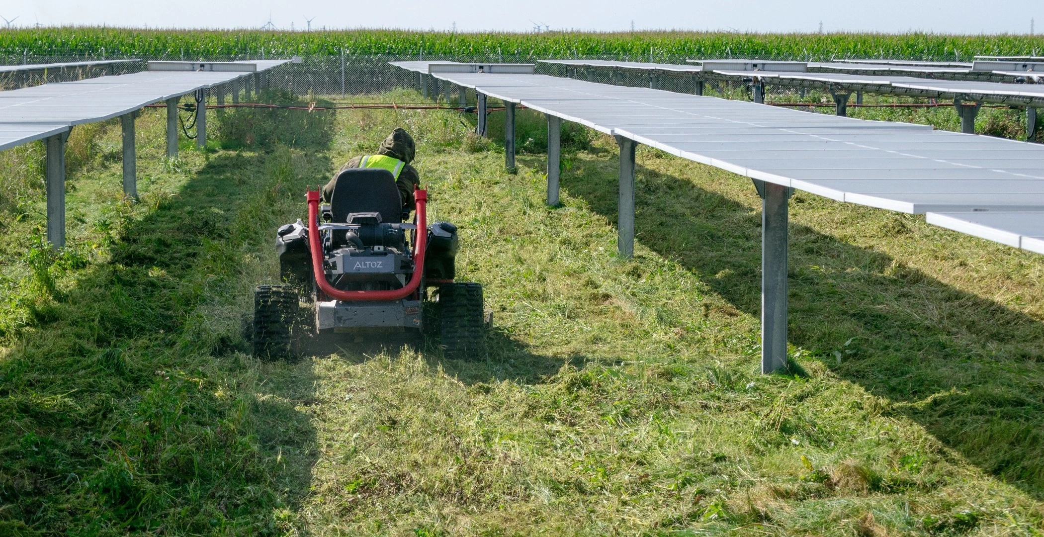 Big Greens worker mowing a commercial solar farm.