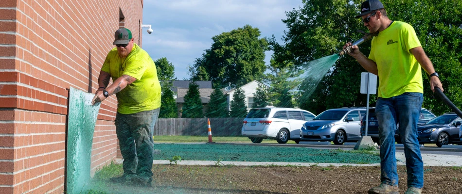 Workers servicing business with hydroseeding in Kentucky.